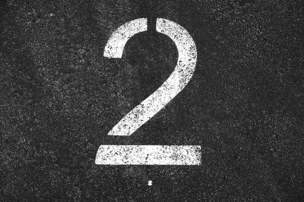 two, 2, number two, number, numeral, digit, symbol, white number two, tarmac, parking lot, parking section, indication, gray digital, gray park, gray numbers, two, two, number two, number two, number two, number two, number two, number, tarmac